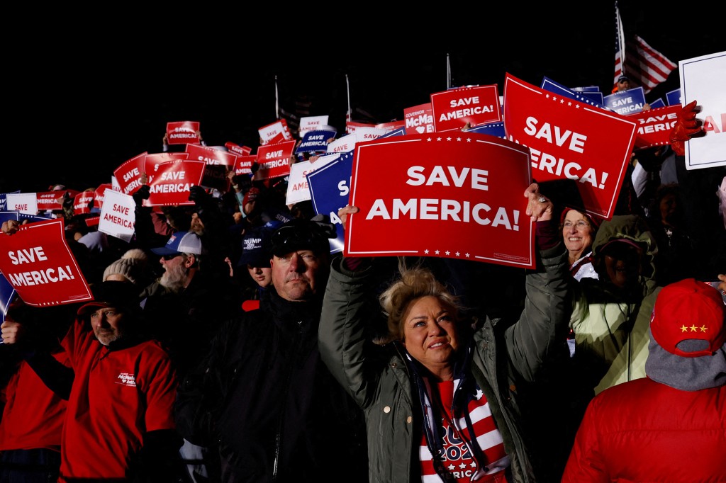 Supporters of former US President Donald Trump attend a rally at Florence Regional Airport in Florence, South Carolina, United States, March 12, 2022.