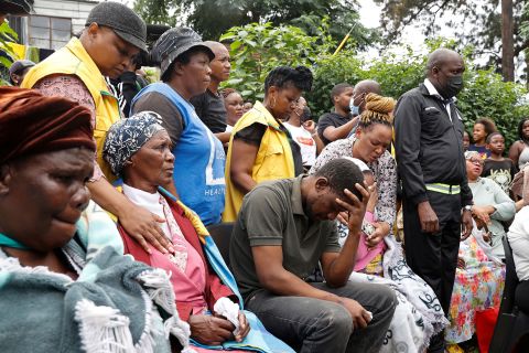 People mourned a church in Claremont, a town in Durban, after four children died after heavy rain and flooding.  Melli Sukhila, center, lost four children when the church on his house collapsed.