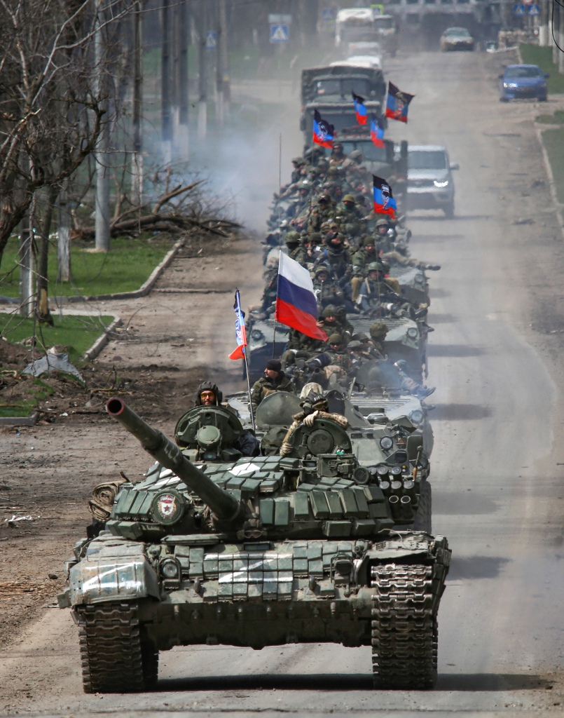 An armored convoy of pro-Russian forces moves along a road during the Ukraine-Russia conflict in the southern port city of Mariupol.