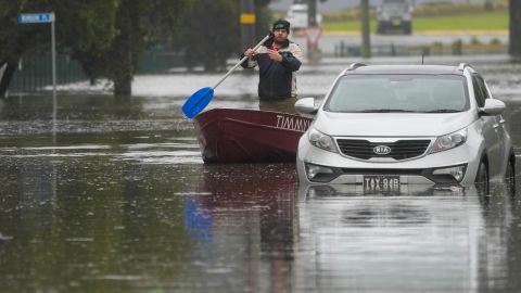 A man rows his boat on a flooded street in Windsor on the outskirts of Sydney, Australia, July 5, 2022.