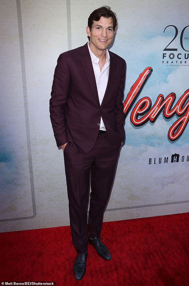 Ashton look: Kutcher wore the red carpet in a slightly messy white shirt under a chestnut no-tie suit coat