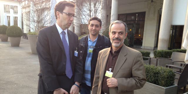 LAUSANNE, SWITZERLAND - MARCH 18: Alan Eyre, left, a US State Department spokesman in Persian speaks with Iranian reporters during the Iran nuclear talks in Lausanne, Switzerland, March 18, 2015. 