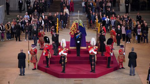 Queen Elizabeth II's grandchildren held a vigil beside their grandmother's coffin as it is located in Westminster Hall on Saturday.