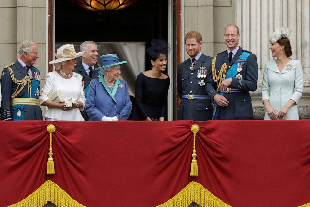 FILE - Britain's Queen Elizabeth II, center left, and from left, Prince Charles, Camilla Duchess of Cornwall, Prince Andrew, Meghan Duchess of Sussex, Prince Harry, Prince William and Kate Duchess of Cambridge, London, July.  10, 2018.